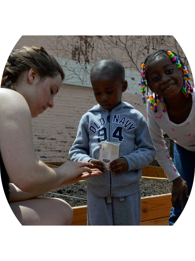 A woman and two children standing next to each other.